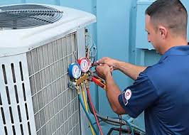 Service technician connecting pressure gauges to a cooling system